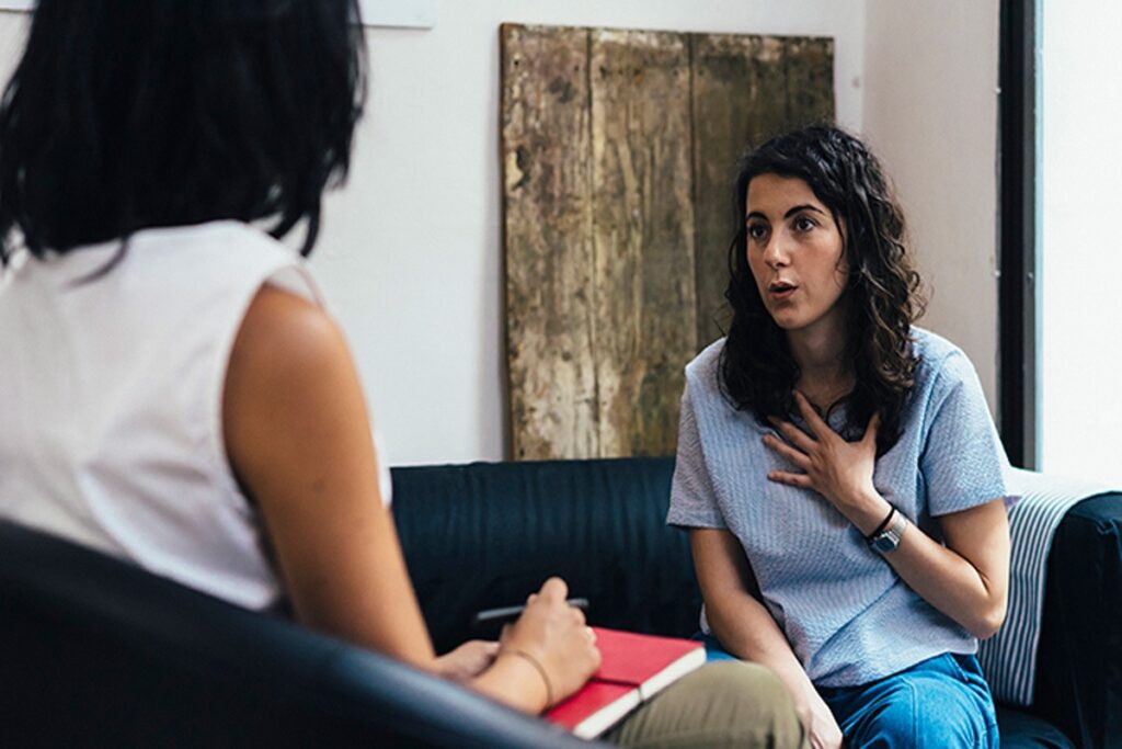 A woman having therapy discussing her anxiety issues.